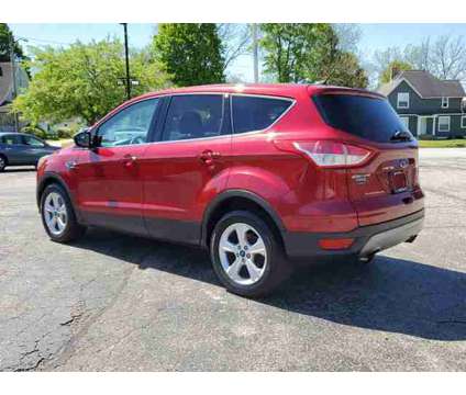 2016 Ford Escape SE is a Red 2016 Ford Escape SE Car for Sale in Paw Paw MI