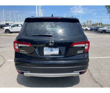 2021 Honda Pilot Touring 7-Passenger is a Black 2021 Honda Pilot Touring Car for Sale in Olathe KS