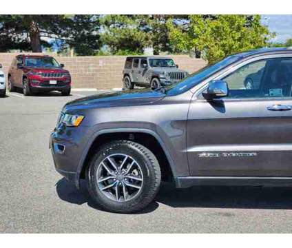 2019 Jeep Grand Cherokee Limited is a Grey 2019 Jeep grand cherokee Limited Car for Sale in Denver CO