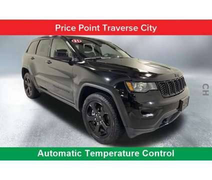 2021 Jeep Grand Cherokee Freedom is a Black 2021 Jeep grand cherokee Car for Sale in Traverse City MI