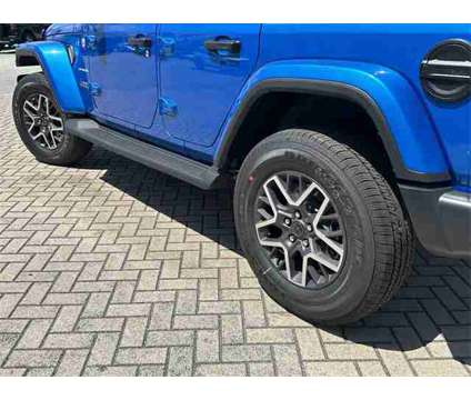 2024 Jeep Wrangler Sahara is a Blue 2024 Jeep Wrangler Sahara SUV in Stuart FL