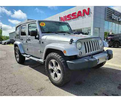 2018 Jeep Wrangler JK Unlimited Sahara is a Silver 2018 Jeep Wrangler Unlimited Sahara SUV in Cullman AL