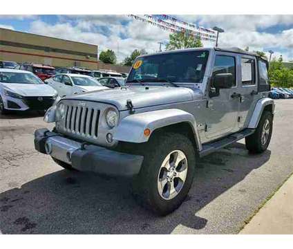 2018 Jeep Wrangler JK Unlimited Sahara is a Silver 2018 Jeep Wrangler Unlimited Sahara SUV in Cullman AL