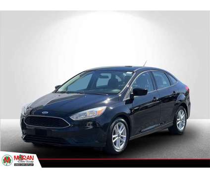 2018 Ford Focus SE is a Black 2018 Ford Focus SE Sedan in Clinton Township MI