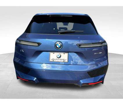 2025 BMW iX xDrive50 is a Blue 2025 BMW 325 Model iX SUV in Huntington Station NY