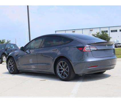 2022 Tesla Model 3 Long Range Dual Motor All-Wheel Drive is a Silver 2022 Tesla Model 3 Long Range Sedan in Friendswood TX
