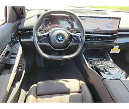 2024 BMW 5 Series i xDrive is a White 2024 BMW 5-Series Sedan in Milford DE