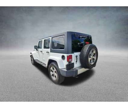 2017 Jeep Wrangler Unlimited Sahara 4x4 is a White 2017 Jeep Wrangler Unlimited Sahara SUV in West Chester PA