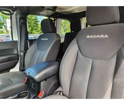 2017 Jeep Wrangler Unlimited Sahara 4x4 is a White 2017 Jeep Wrangler Unlimited Sahara SUV in West Chester PA