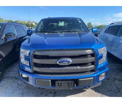 2017 Ford F-150 Lariat is a Blue 2017 Ford F-150 Lariat Car for Sale in Olathe KS