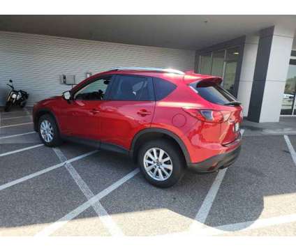 2016 Mazda CX-5 Touring is a Red 2016 Mazda CX-5 Touring SUV in Littleton CO