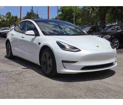 2023 Tesla Model 3 Base is a White 2023 Tesla Model 3 Sedan in Miami FL