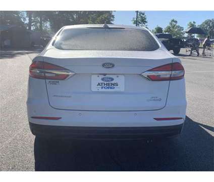 2019 Ford Fusion Hybrid SE is a White 2019 Ford Fusion Hybrid SE Hybrid in Bogart GA