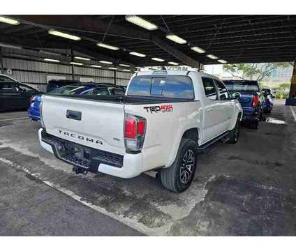 2021 Toyota Tacoma TRD Sport is a White 2021 Toyota Tacoma TRD Sport Car for Sale in Orlando FL