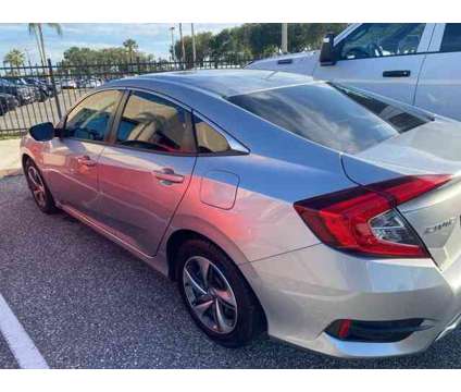 2021 Honda Civic LX is a Black 2021 Honda Civic LX Car for Sale in Orlando FL