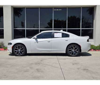 2015UsedDodgeUsedChargerUsed4dr Sdn RWD is a White 2015 Dodge Charger Car for Sale in Lewisville TX