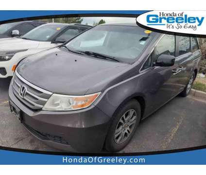 2011 Honda Odyssey EX is a Grey 2011 Honda Odyssey EX Car for Sale in Greeley CO
