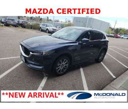 2021 Mazda CX-5 Grand Touring is a Blue 2021 Mazda CX-5 Grand Touring SUV in Littleton CO