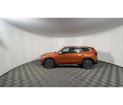 2024 BMW X1 xDrive28i is a Orange 2024 BMW X1 xDrive 28i SUV in Freeport NY