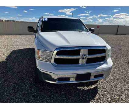 2014 Ram 1500 Quad Cab for sale is a White 2014 RAM 1500 Model Car for Sale in Farmington NM