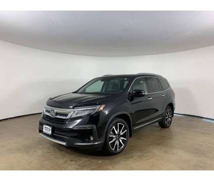 2019 Honda Pilot Touring is a Black 2019 Honda Pilot Touring Car for Sale in Peoria IL