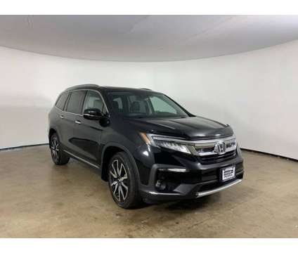 2019 Honda Pilot Touring is a Black 2019 Honda Pilot Touring Car for Sale in Peoria IL