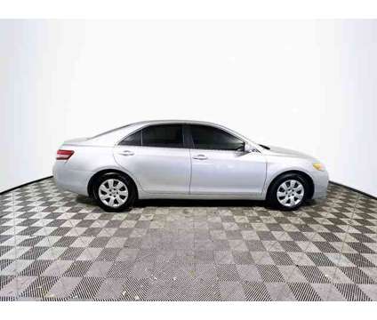 2010 Toyota Camry LE is a White 2010 Toyota Camry LE Car for Sale in Tampa FL