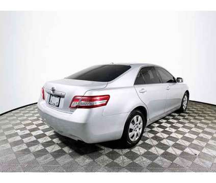 2010 Toyota Camry LE is a White 2010 Toyota Camry LE Car for Sale in Tampa FL