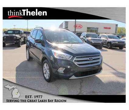 2019 Ford Escape SEL is a Green 2019 Ford Escape SEL SUV in Bay City MI