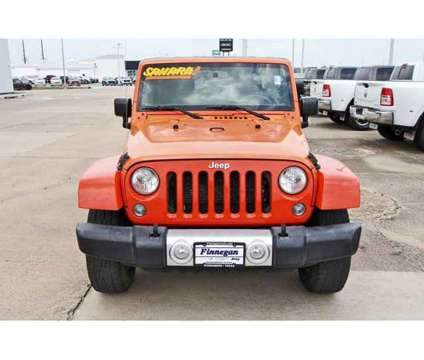 2015 Jeep Wrangler Unlimited Sahara is a Orange 2015 Jeep Wrangler Unlimited Sahara SUV in Rosenberg TX