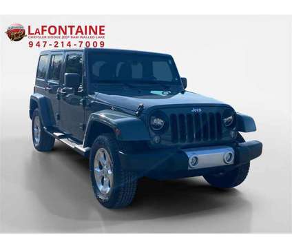 2014 Jeep Wrangler Unlimited Sahara is a 2014 Jeep Wrangler Unlimited Sahara SUV in Walled Lake MI