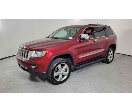 2013 Jeep Grand Cherokee Overland is a Red 2013 Jeep grand cherokee Overland SUV in Las Vegas NV