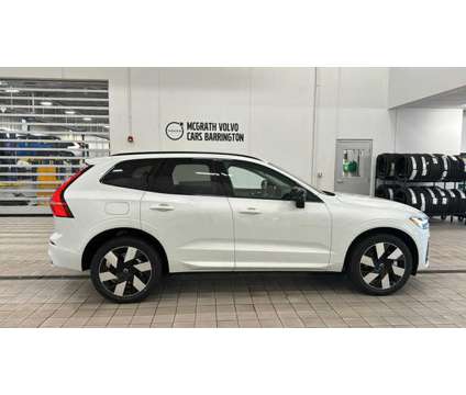 2024 Volvo XC60 Recharge Plug-In Hybrid Plus Dark Theme is a White 2024 Volvo XC60 3.2 Trim Hybrid in Barrington IL