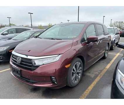 2021 Honda Odyssey Touring is a Red 2021 Honda Odyssey Touring Car for Sale in Rochester NY