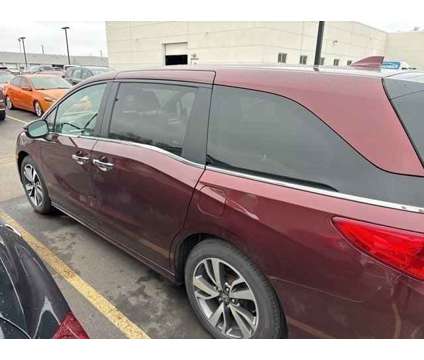 2021 Honda Odyssey Touring is a Red 2021 Honda Odyssey Touring Car for Sale in Rochester NY
