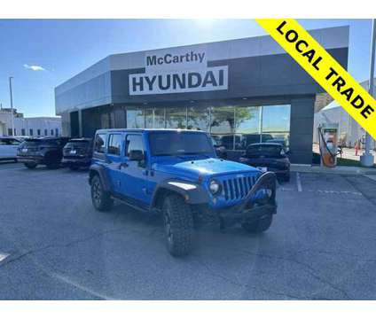 2016 Jeep Wrangler Unlimited Sport is a Blue 2016 Jeep Wrangler Unlimited Sport Car for Sale in Olathe KS