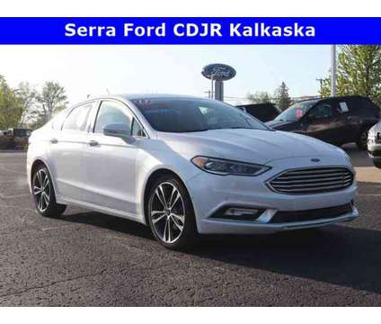 2017 Ford Fusion Platinum is a White 2017 Ford Fusion Platinum Car for Sale in Traverse City MI
