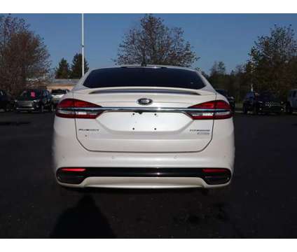 2017 Ford Fusion Platinum is a White 2017 Ford Fusion Platinum Car for Sale in Traverse City MI