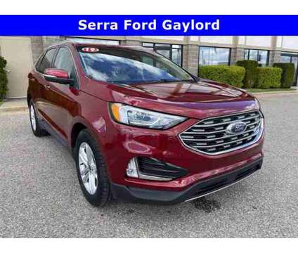 2019 Ford Edge SEL is a Red 2019 Ford Edge SEL Car for Sale in Traverse City MI