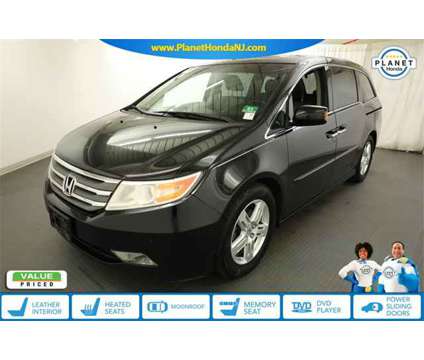 2012 Honda Odyssey is a Black 2012 Honda Odyssey Car for Sale in Union NJ