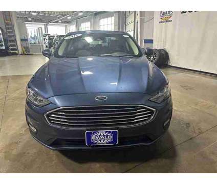 2019 Ford Fusion SE is a Blue 2019 Ford Fusion SE Sedan in Milwaukee WI