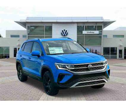 2024 Volkswagen Taos 1.5T SEL is a Blue 2024 1.5T SEL SUV in Sterling VA