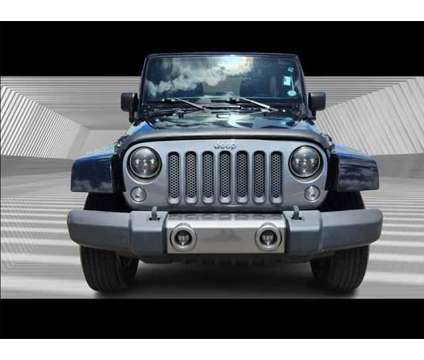 2014 Jeep Wrangler Unlimited Freedom Edition is a Black 2014 Jeep Wrangler Unlimited SUV in Fort Lauderdale FL