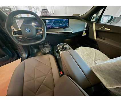 2025 BMW iX xDrive50 is a Blue 2025 BMW 325 Model iX SUV in Peabody MA