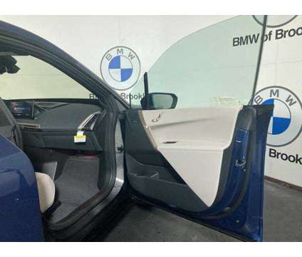 2025 BMW iX xDrive50 is a Blue 2025 BMW 325 Model iX SUV in Brooklyn NY