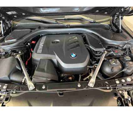 2024 BMW 5 Series i xDrive is a Grey 2024 BMW 5-Series Sedan in Dubuque IA