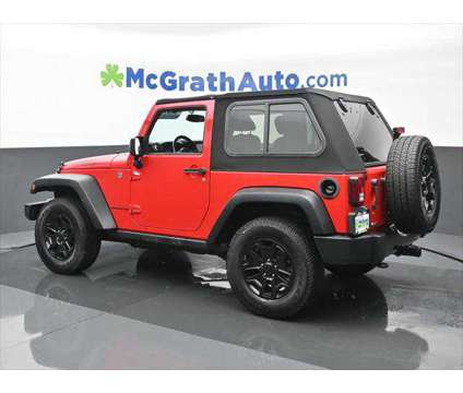 2015 Jeep Wrangler Willys Wheeler is a Red 2015 Jeep Wrangler SUV in Dubuque IA