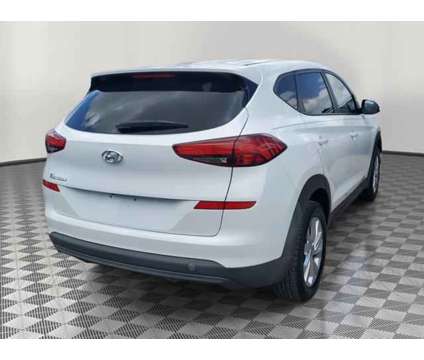 2019 Hyundai Tucson SE is a White 2019 Hyundai Tucson SE SUV in Orlando FL