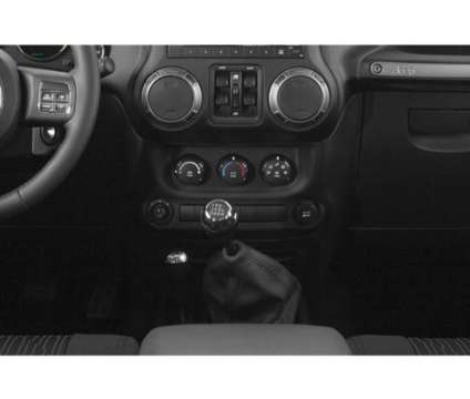 2018 Jeep Wrangler JK Unlimited Freedom Edition 4x4 is a Black 2018 Jeep Wrangler SUV in Raynham MA