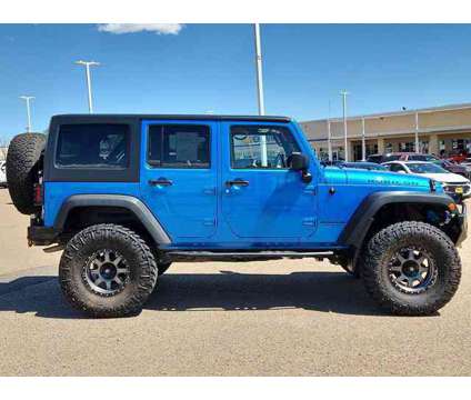 2015 Jeep Wrangler Unlimited Rubicon is a Blue 2015 Jeep Wrangler Unlimited Rubicon SUV in Pueblo CO